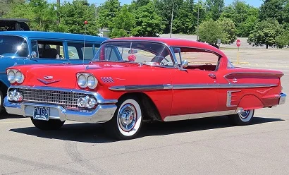 1958_Chevrolet_Bel_Air_Impala_Sport_Coupe,_front_left,_06-15-2024.webp